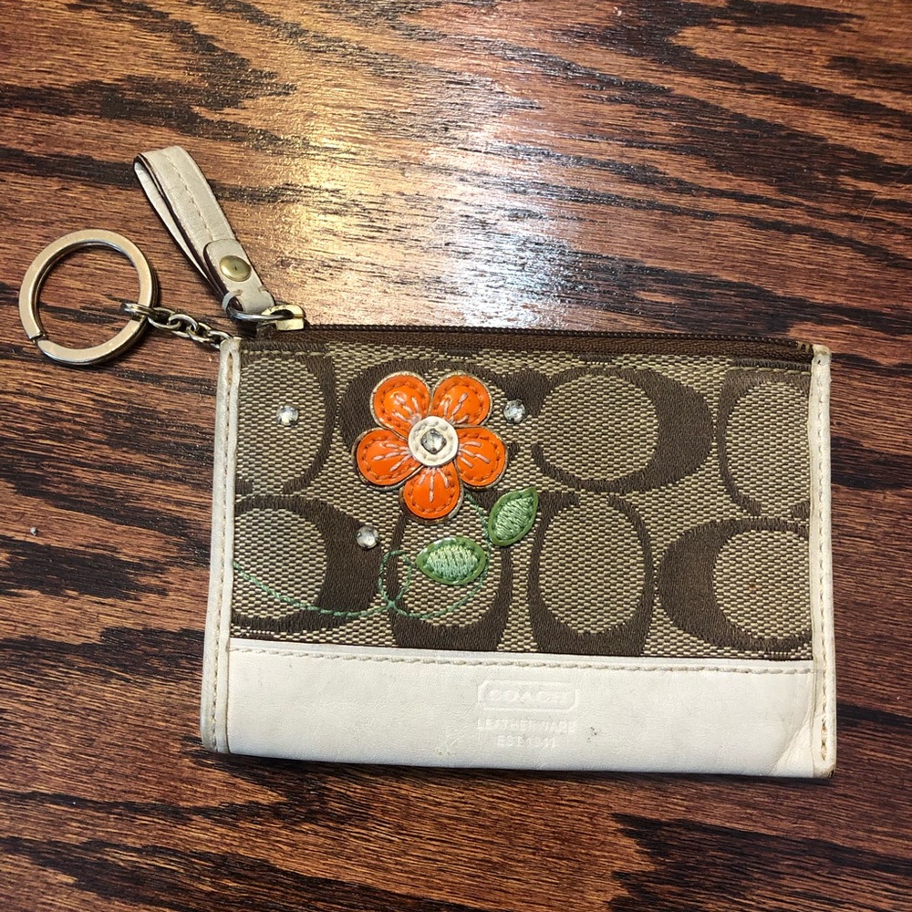 Coach wristlet with orange flower detail 🌼